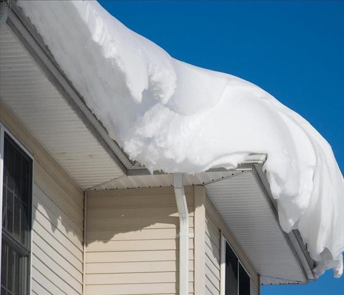 Image of snow on top of residential roof